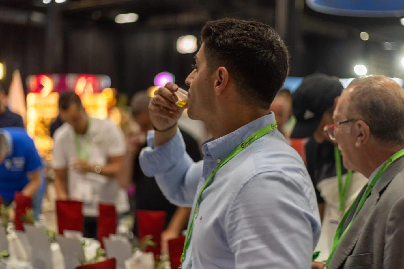 Buyer sampling product at an exhibitor stand